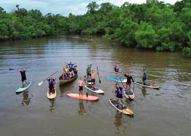 Do lixo ao recomeço: na Amazônia, projeto usa stand up paddle para limpar rios e recuperar vidas